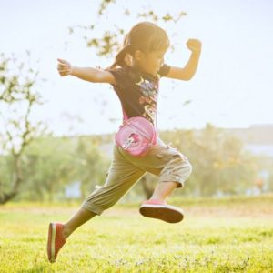 Girl running outdoors